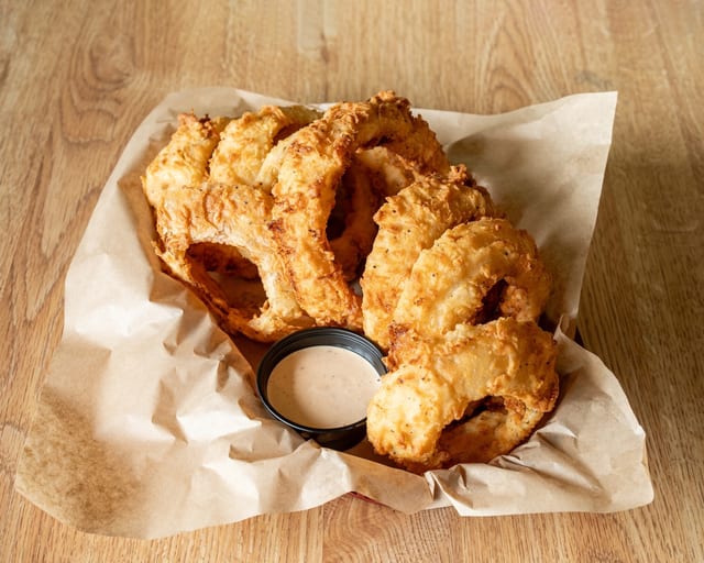 Handbreaded Onion Rings.